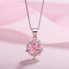 Asuka Cherry Blossom Necklace - Small, delicate crystal flower pendant on a silver box chain, with either pink or white stones.