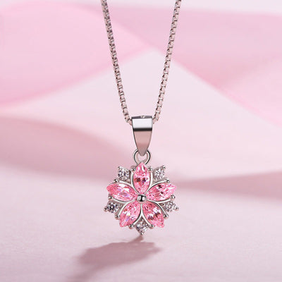 Asuka Cherry Blossom Necklace - Small, delicate crystal flower pendant on a silver box chain, with either pink or white stones.