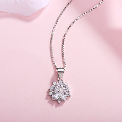 Asuka Cherry Blossom Necklace - Small, delicate crystal flower pendant on a silver box chain, with either pink or white stones.