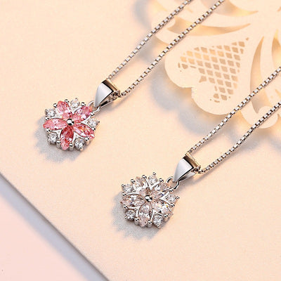 Asuka Cherry Blossom Necklace - Small, delicate crystal flower pendant on a silver box chain, with either pink or white stones.