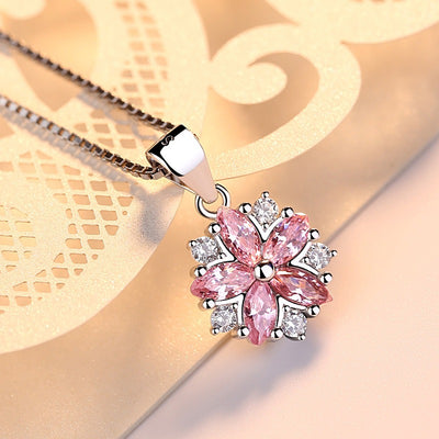 Asuka Cherry Blossom Necklace - Small, delicate crystal flower pendant on a silver box chain, with either pink or white stones.