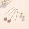 Asuka Cherry Blossom Tassel Drop Earrings - Small, delicate crystal flowers suspended from a long silver threader earring.