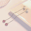 Asuka Cherry Blossom Tassel Drop Earrings - Small, delicate crystal flowers suspended from a long silver threader earring.