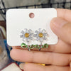 Maisey Crystal Daisy Stud Earrings - Small, delicate daisy-themed earrings, formed from a mixture of white quartz, and green and yellow topaz.