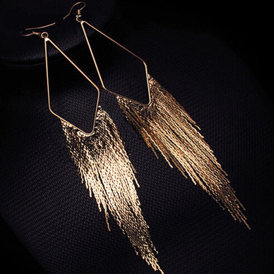 Malaika Tassel Earrings - Long stylish statement dangles, featuring a hollow diamond shape with tassels strung off it.