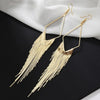 Malaika Tassel Earrings - Long stylish statement dangles, featuring a hollow diamond shape with tassels strung off it.