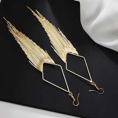 Malaika Tassel Earrings - Long stylish statement dangles, featuring a hollow diamond shape with tassels strung off it.