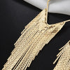Malaika Tassel Earrings - Long stylish statement dangles, featuring a hollow diamond shape with tassels strung off it.