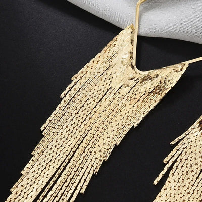 Malaika Tassel Earrings - Long stylish statement dangles, featuring a hollow diamond shape with tassels strung off it.