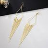 Malaika Tassel Earrings - Long stylish statement dangles, featuring a hollow diamond shape with tassels strung off it.