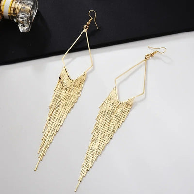 Malaika Tassel Earrings - Long stylish statement dangles, featuring a hollow diamond shape with tassels strung off it.