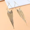 Malaika Tassel Earrings - Long stylish statement dangles, featuring a hollow diamond shape with tassels strung off it.