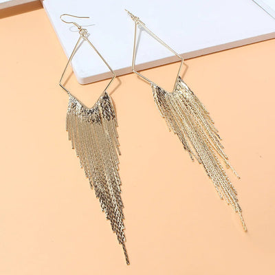 Malaika Tassel Earrings - Long stylish statement dangles, featuring a hollow diamond shape with tassels strung off it.