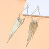 Malaika Tassel Earrings - Long stylish statement dangles, featuring a hollow diamond shape with tassels strung off it.
