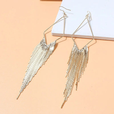 Malaika Tassel Earrings - Long stylish statement dangles, featuring a hollow diamond shape with tassels strung off it.