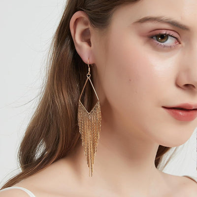 Malaika Tassel Earrings - Long stylish statement dangles, featuring a hollow diamond shape with tassels strung off it.