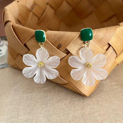 Margaret Apple Blossom Drop Earrings - Lovely stylised white apple blossom earrings sculpted from semi-translucent white acetate, suspended from a green enamel earring finding.