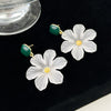 Margaret Apple Blossom Drop Earrings - Lovely stylised white apple blossom earrings sculpted from semi-translucent white acetate, suspended from a green enamel earring finding.