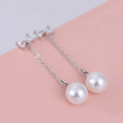 The Medusa Chain Drop Earrings - Adorable long dangling stud earrings with a crystal bow and a pearl at the end.