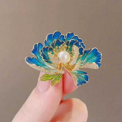 Megan Ruffled Blossom Resin Brooch - An elegant floral brooch available in blue-green, hot pink, purple, or soft pink, with shimmering crystals and semi-translucent resin.