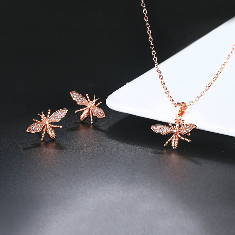 Melaina Bee Crystal Pendant & Earrings Set - Cute little rose gold stud earrings shaped like little honeybees, with round cut crystals on the wings, and a matching necklace.