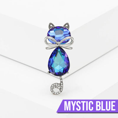 Mimmy Crystal Cat Brooch - A cute, stylised cat brooch featuring large coloured crystals for the head and body, and small round white quartz set into the ears and tail.