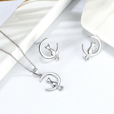 Moonlight Meowl Set - A delicate sterling silver jewellery set featuring a tiny kitty sitting on a crescent moon.