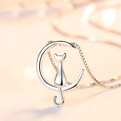 Moonlight Meowl Set - A delicate sterling silver jewellery set featuring a tiny kitty sitting on a crescent moon.