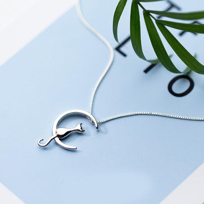 Moonlight Meowl Set - A delicate sterling silver jewellery set featuring a tiny kitty sitting on a crescent moon.