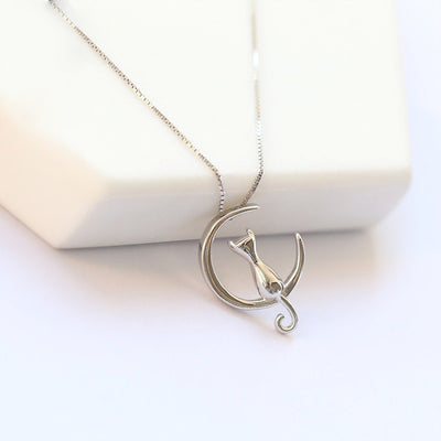 Moonlight Meowl Set - A delicate sterling silver jewellery set featuring a tiny kitty sitting on a crescent moon.