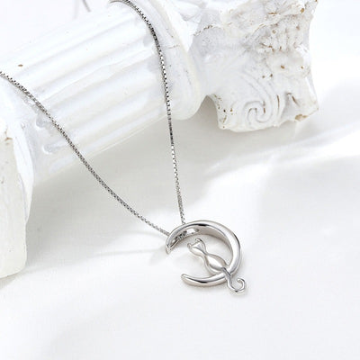 Moonlight Meowl Set - A delicate sterling silver jewellery set featuring a tiny kitty sitting on a crescent moon.