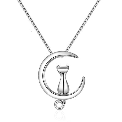 Moonlight Meowl Set - A delicate sterling silver jewellery set featuring a tiny kitty sitting on a crescent moon.