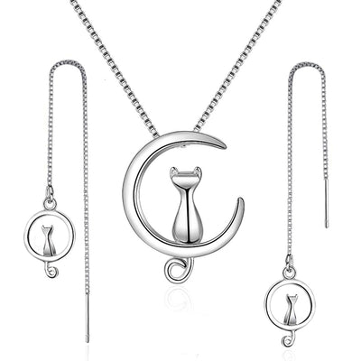 Moonlight Meowl Set - A delicate sterling silver jewellery set featuring a tiny kitty sitting on a crescent moon.