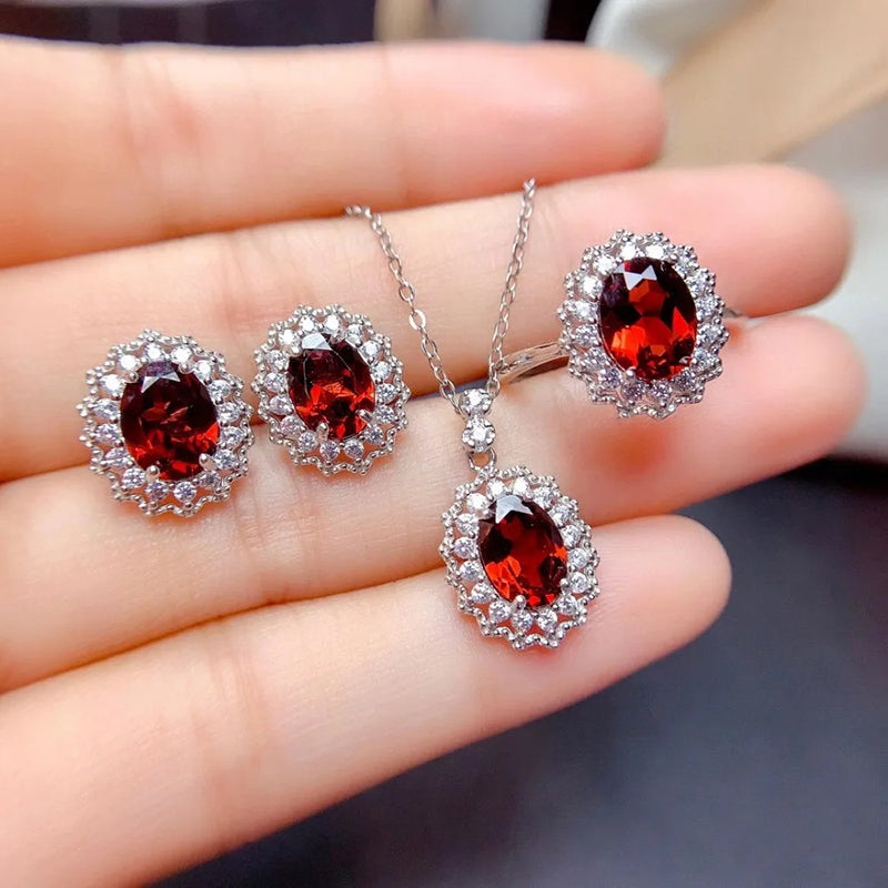 Natasha Luxury Crystal Jewellery Set - A lovely crystal jewellery set featuring oval-cut red stones surrounded by quartz in a classic entourage style.