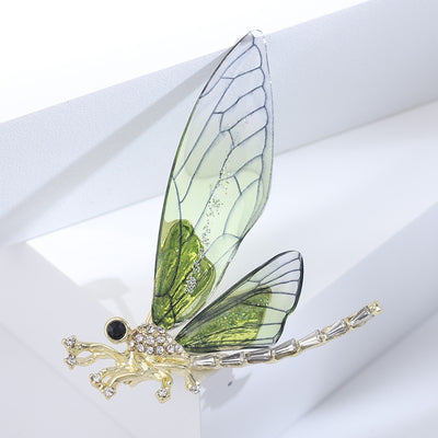 Nevaeh Dragonfly Brooch - A large, stylized dragonfly brooch with colourful epoxy resin wings, available in blue, green, or red.