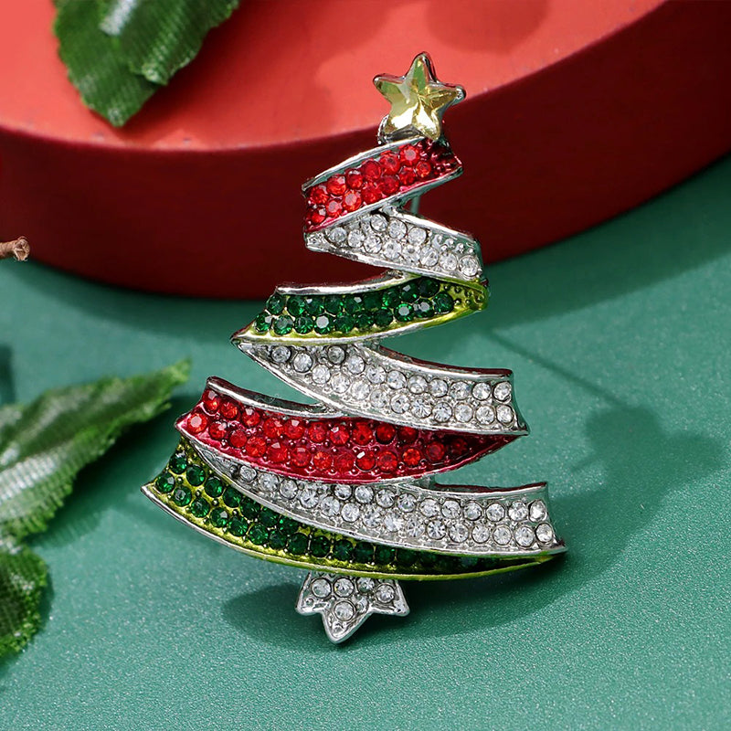 Noelle Christmas Tree Crystal Brooch - A lovely, sparkly crystal brooch shaped like a classic Christmas tree, adorned with red, green, and white stones and a golden star on top.