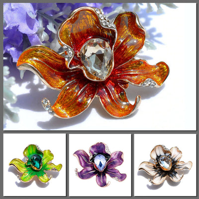 The Odessa Enamel Orchid Brooch - A lovely flower-themed brooch featuring six wavy petals around a large teardrop-shaped central stone.