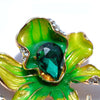 The Odessa Enamel Orchid Brooch - A lovely flower-themed brooch featuring six wavy petals around a large teardrop-shaped central stone.