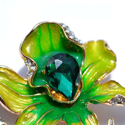 The Odessa Enamel Orchid Brooch - A lovely flower-themed brooch featuring six wavy petals around a large teardrop-shaped central stone.
