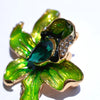 The Odessa Enamel Orchid Brooch - A lovely flower-themed brooch featuring six wavy petals around a large teardrop-shaped central stone.