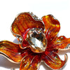 The Odessa Enamel Orchid Brooch - A lovely flower-themed brooch featuring six wavy petals around a large teardrop-shaped central stone.
