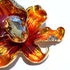 The Odessa Enamel Orchid Brooch - A lovely flower-themed brooch featuring six wavy petals around a large teardrop-shaped central stone.