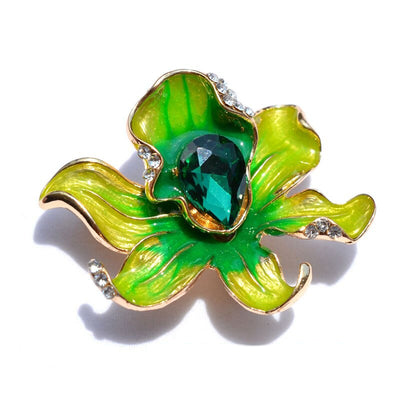 The Odessa Enamel Orchid Brooch - A lovely flower-themed brooch featuring six wavy petals around a large teardrop-shaped central stone.