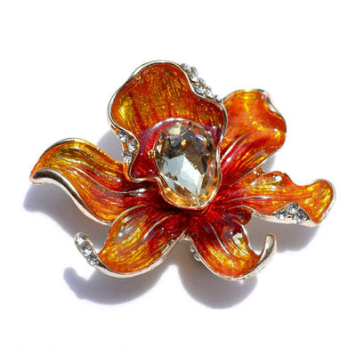 The Odessa Enamel Orchid Brooch - A lovely flower-themed brooch featuring six wavy petals around a large teardrop-shaped central stone.