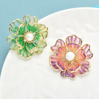 The Ophelia Peony Sculpted Resin Brooch - An elegant floral brooch available in green, salmon, purple, or ombre sunset, with shimmering crystals and semi-translucent resin.