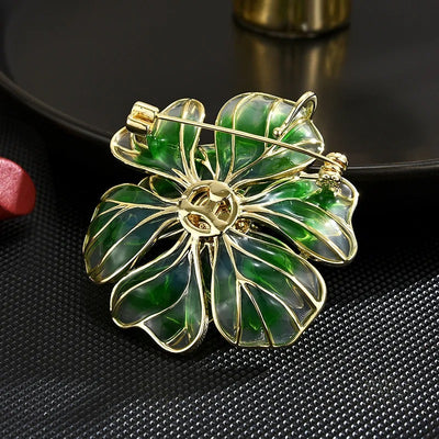 The Ophelia Peony Sculpted Resin Brooch - An elegant floral brooch available in green, salmon, purple, or ombre sunset, with shimmering crystals and semi-translucent resin.