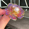 The Ophelia Peony Sculpted Resin Brooch - An elegant floral brooch available in green, salmon, purple, or ombre sunset, with shimmering crystals and semi-translucent resin.