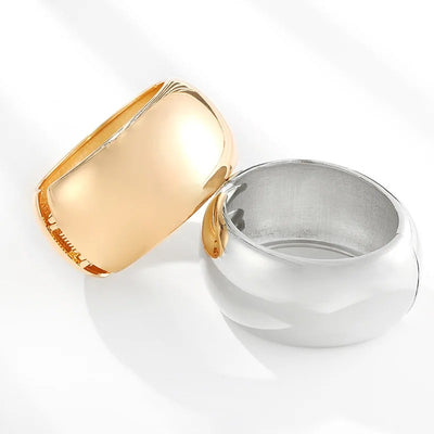 Ovalyn Hinged Cuff Bangle - A simple round gold bangle with a mirrored finish, available in champagne or white gold.