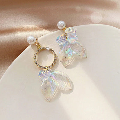 Pearla Iridescent Acrylic Earrings - Lovely lopsided iridescent earrings with a seaside theme, featuring seashells, fish tails, crystals, and pearls.