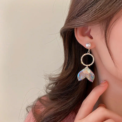 Pearla Iridescent Acrylic Earrings - Lovely lopsided iridescent earrings with a seaside theme, featuring seashells, fish tails, crystals, and pearls.